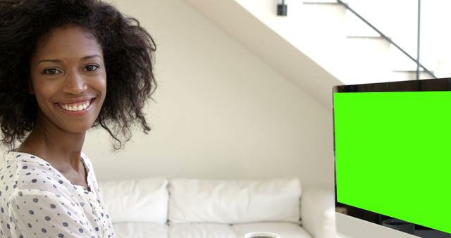 Smiling African American Woman Working at Home with Computer Monitor on Green Screen - Download Free Stock Images Pikwizard.com