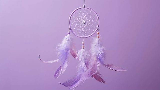 Pastel Purple Dreamcatcher with Feathers on Lavender Background