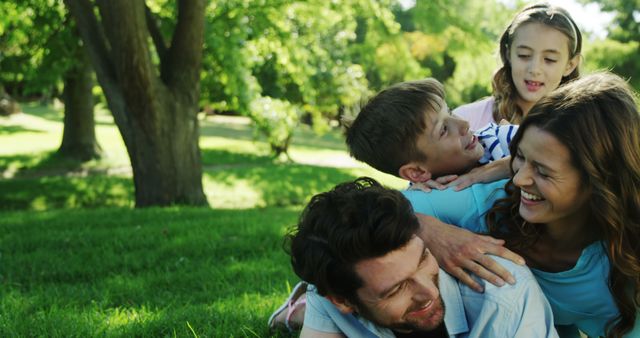 Happy family having fun outdoors on a sunny day - Download Free Stock Images Pikwizard.com