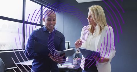 Business Team Analyzing Data with Futuristic Overlay in Office