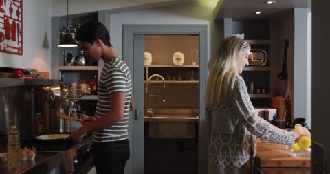 Couple Cooking Breakfast Together in Modern Kitchen
