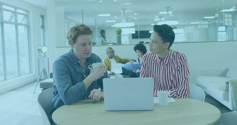 Professionals collaborating in modern open office space