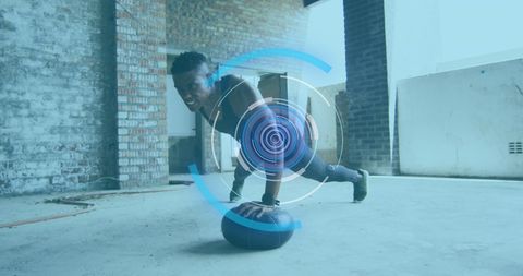 Man Exercising with Medicine Ball Enhanced by Digital Interface