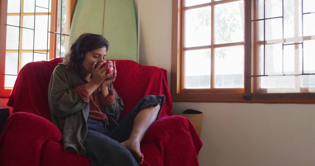 Young Woman Relaxing with Coffee on Comfortable Armchair at Home - Download Free Stock Images Pikwizard.com