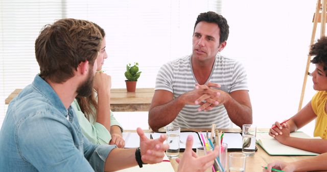 Team discussing project ideas in modern office - Download Free Stock Images Pikwizard.com