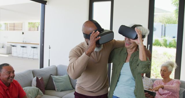 Senior Couple Enjoying Virtual Reality with Friends in Living Room - Download Free Stock Images Pikwizard.com