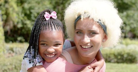 Joyful Mother and Daughter Bonding Outdoors on a Sunny Day