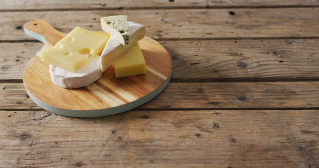 Assorted Cheeses on Wooden Serving Board - Download Free Stock Images Pikwizard.com