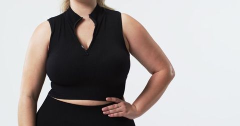 Confident Plus Size Woman in Black Outfit Posing