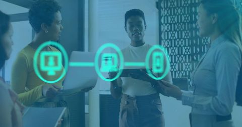 Diverse Colleagues Discussing Digital Network Connections in Office