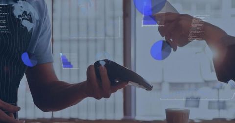 Staff presenting card reader while customer tapping phone for contactless coffee payment