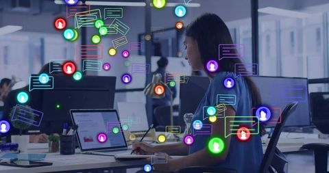 Office worker collaborating digitally in modern workspace