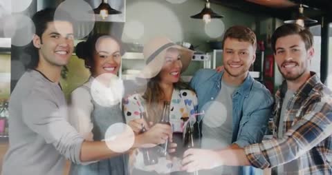 Group of Friends Toasting with Bottles in Home Gathering