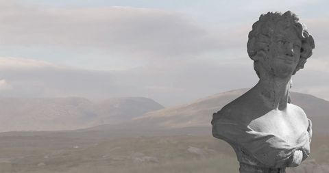 Classical Stone Sculpture Over Misty Mountain Landscape