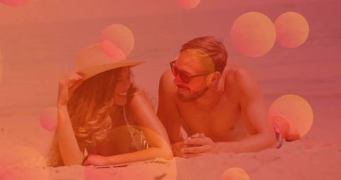 Happy Couple Enjoying Leisure Time on Sandy Beach