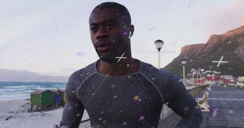 Focused Athlete Jogging by Ocean Promenade at Sunrise