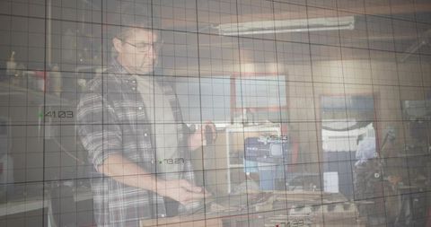 Mechanic Examining Engine Block in Rustic Garage Workshop