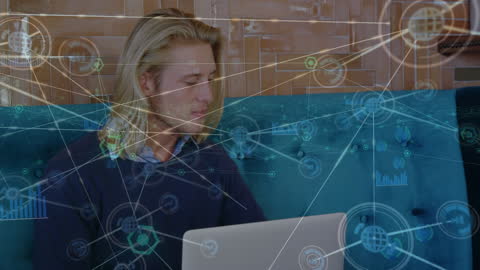 Man Working on Laptop with Digital Network Overlay