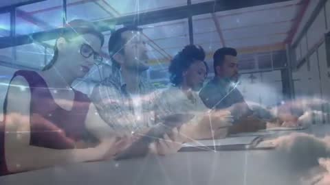 Team Innovating with Technology During Business Meeting