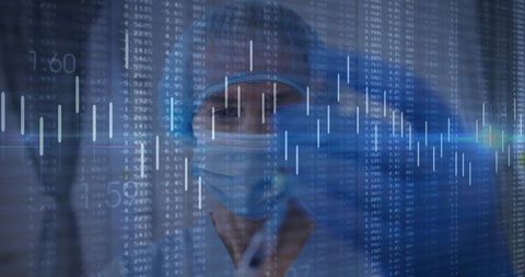 Doctor Analyzing Financial Charts in Healthcare Environment