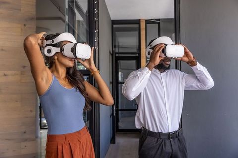Diverse coworkers immersed in virtual reality innovation