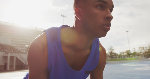 Dedicated Athlete Preparing for a Sprint - Download Free Stock Images Pikwizard.com