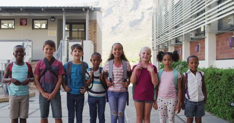 Joyful Schoolchildren Standing Together with Backpacks Outdoors - Download Free Stock Images Pikwizard.com