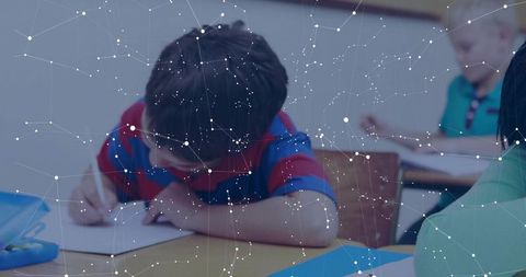 Young student focusing on writing task in classroom setting