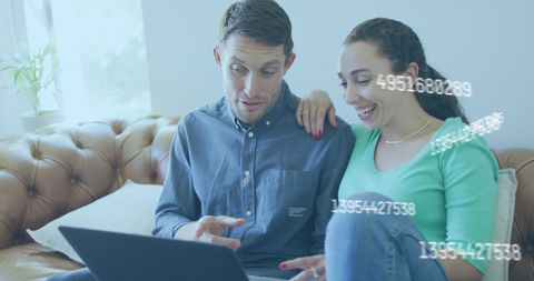 Couple Engaging with Digital Finance on Laptop