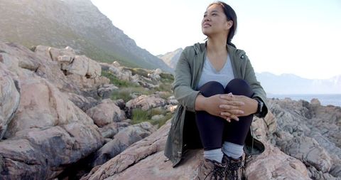 Woman Enjoying Scenic Mountain Vista During Outdoor Adventure