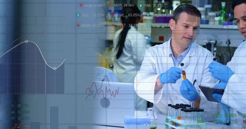 Lab scientists exchanging amber vial while consulting tablet with digital data overlay