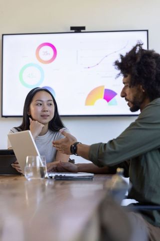 Cooperation in Business Strategy Meeting with Digital Data Analysis