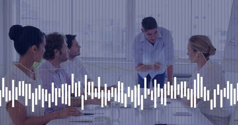 Leader Pointing and Presenting to Team in Conference Room with Waveform Data Overlay