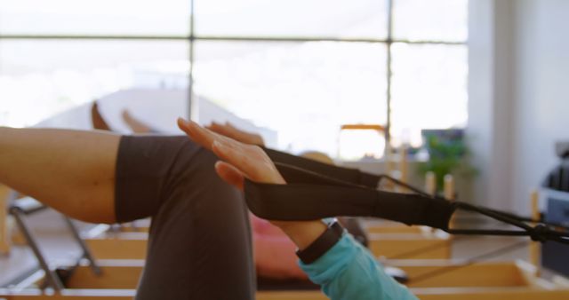 Person Practicing Pilates on Reformer Machine in Bright Fitness Studio - Download Free Stock Images Pikwizard.com