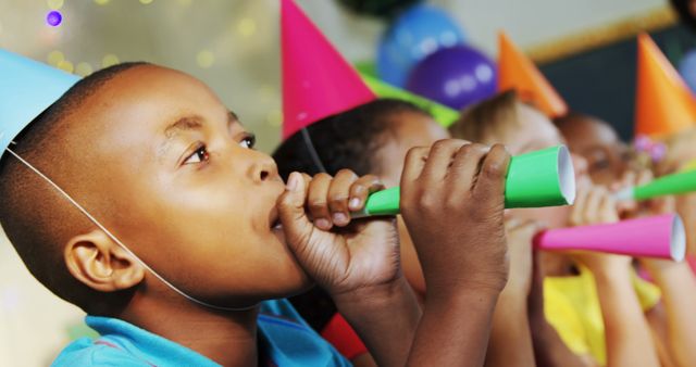 Children Enjoying Birthday Party with Party Hats and Blowers - Download Free Stock Images Pikwizard.com