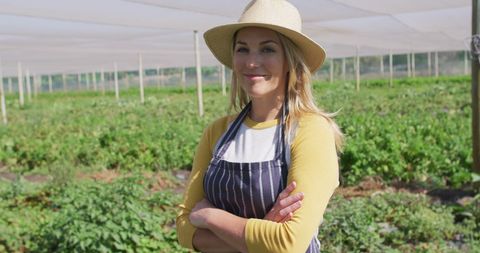 Confident Female Farmer in Greenhouse Smiling - Download Free Stock Images Pikwizard.com