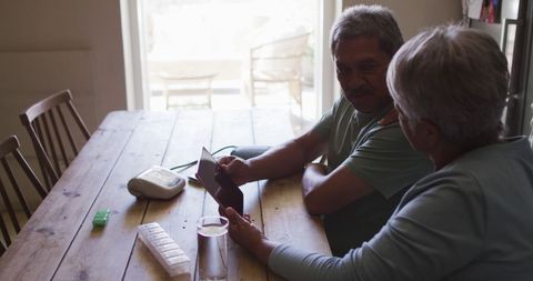 Senior Couple Engaged in Virtual Medical Consultation at Home