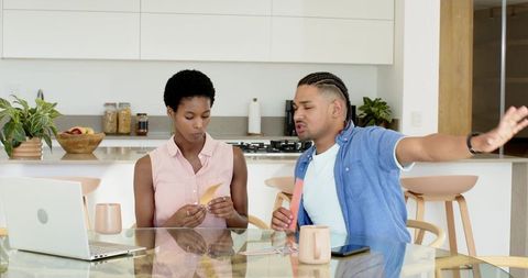 Diverse Friends Discuss Contemporary Design in Modern Kitchen