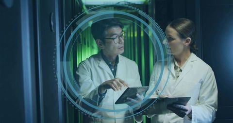 Engineers Analyzing Digital Data in Modern Data Center