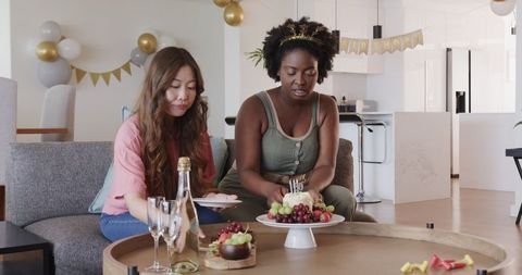 Interracial LGBTQ+ Couple Enjoying Birthday Celebration at Home