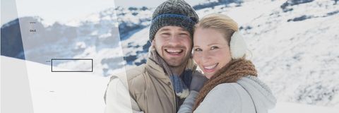 Joyful Caucasian Couple Embracing in Snowy Landscape