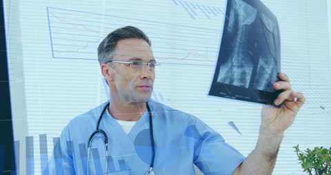 Caucasian Doctor Analyzing X-ray with Data Overlay