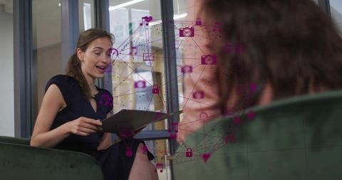 Businesswoman presenting with tablet in modern office lounge with purple network overlay
