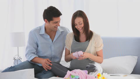Expectant Couple Joyfully Preparing for New Arrival