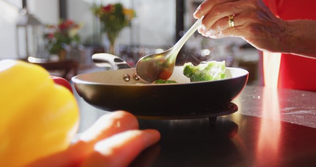 Close-up of Hand Cooking Stir Fry Vegetables in Kitchen - Download Free Stock Images Pikwizard.com