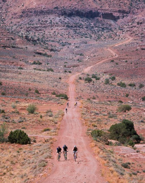 Group of Cyclists Riding on Rugged Desert Trail - Download Free Stock Photos Pikwizard.com