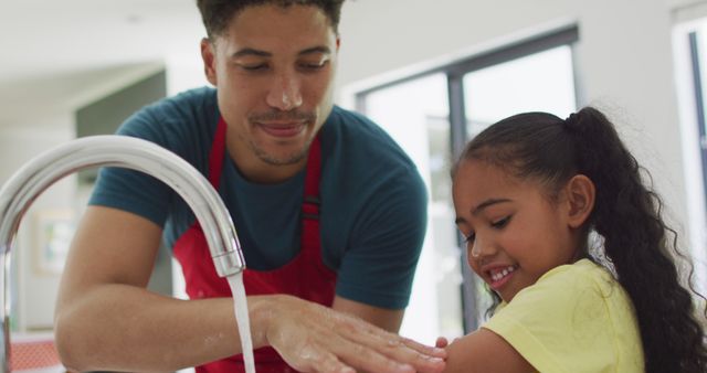 Father and Daughter Washing Hands Together at Kitchen Sink - Download Free Stock Images Pikwizard.com