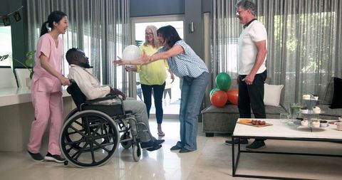 Welcoming Disabled Patient into Care Facility with Smiles and Support