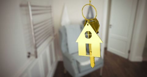 Golden House-Shaped Keyring Enhancing Stylish Home Entry