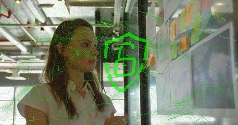 Woman collaborating on whiteboard with cybersecurity concept